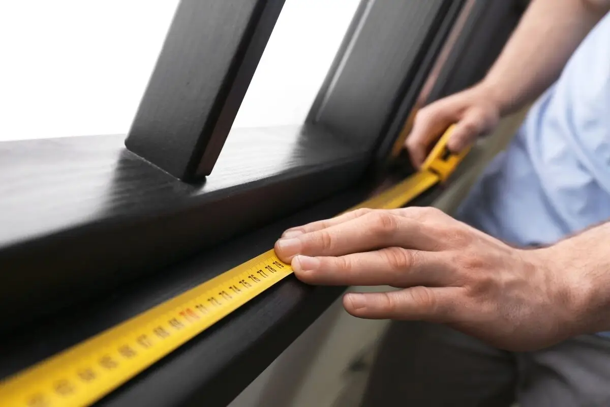 Measuring tape on a windowsill, showing precision